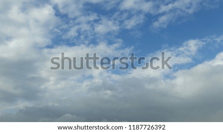 fluffy clouds in sky 