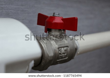 Red water valve on pipeline