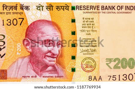 
Mahatma Gandhi face portrait on India 200 rupee (2017) banknote . banknotes is the national currency of India, Close Up UNC Uncirculated - Collection. Royalty-Free Stock Photo #1187769934