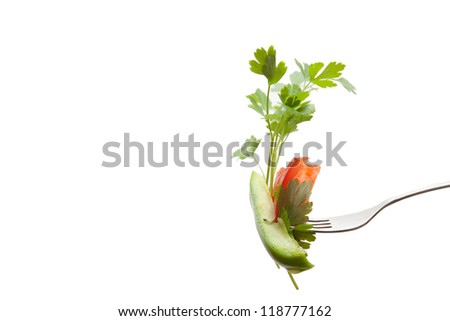 Parsley, pepper and tomato on a fork
