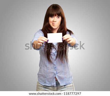 Funny Girl Showing Blank Paper On Gray Background