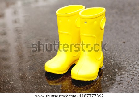 Child wearing rain boots 