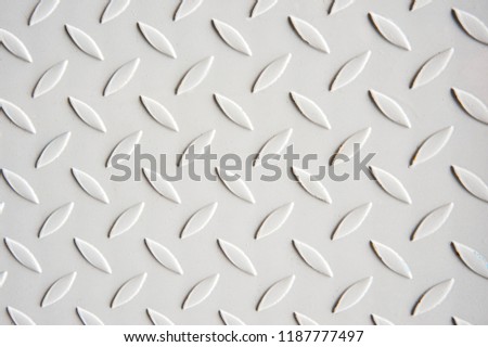 Painted white Metal checkered steel plates background. Industrial texture
