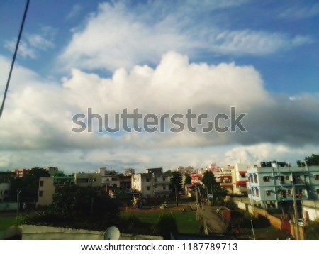 This picture is clicked from my balcony when the weather was very fine and it seems that clouds are very low in the sky.