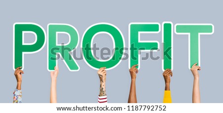 Hands holding up green letters forming the word profit