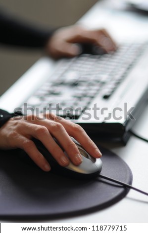 Picture of female hand on computer mouse