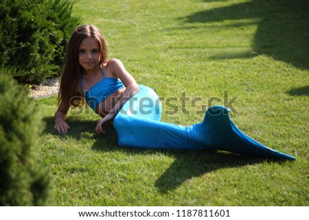 Beautiful girl in mermaid clothes.