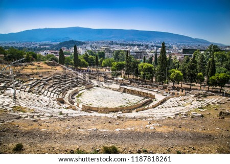 Panoramic view of the Theatre of Dionysus at the foot of Acropolis in Athens, Greece. It is one of the main landmark of Athens. Scenic panorama of ancient Greek ruins of Theatre of Dionysus.