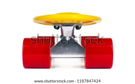 Yellow cruiser penny plastboard with red wheels isolated on white background, front view