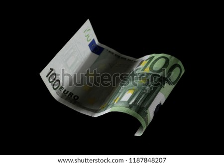 Hundred Euro bill, banknote isolated on black background