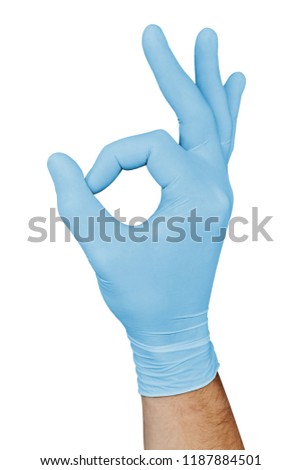 Male hand in blue medical glove showing approval ok sign isolated on white background