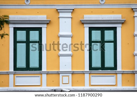 Abstract scene  of green window and yellow wall of building texture background of museum bangkok thailand