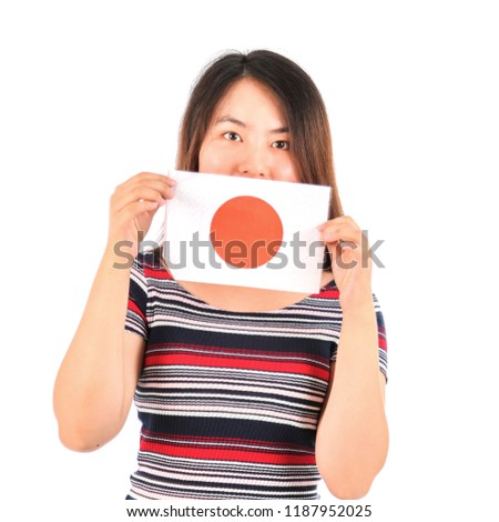 Young asian woman holding the flag of Japan against a white background