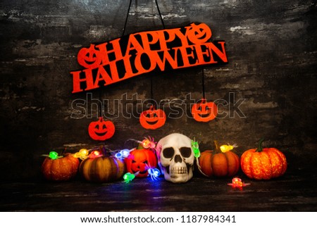 Halloween concept with a pumpkin and skeleton on background