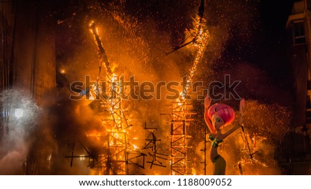 The last parts in the fire of the burning Falla Taut during la Crema final event during Las Fallas festival in Valencia Community, city of Cullera in Spain.