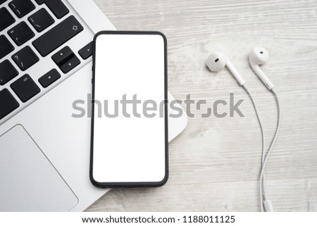 Smartphone on the table with earphone