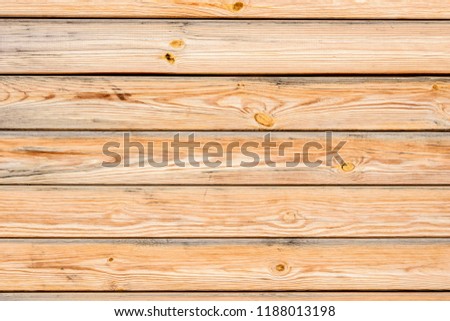 Wood texture of brushed pine planks with knots. Rustic wood panel. Abstract background with spruce grain pattern. Distressed wood texture. Aged wood wallpaper. Table top view. Royalty-Free Stock Photo #1188013198