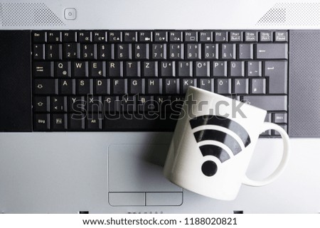 Table of office stuff Business man with Laptop, Coffee Cup WIFI symbol.Concept office Business man workplace
