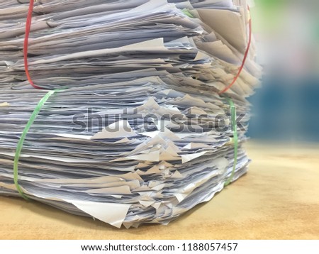 stack pile of paper on wood background