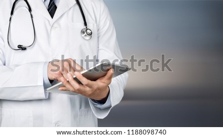 Close-up Doctor at hospital working with tablet
