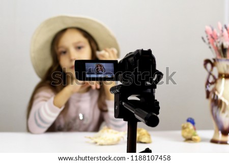 little girl is a blogger in the hat tells the story of camping