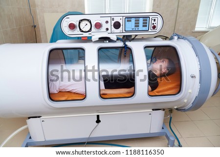 Hyperbaric oxygen chamber in a hospital. Royalty-Free Stock Photo #1188116350