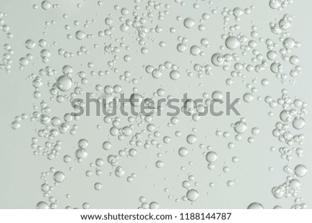 Light green bubbles over a soft background.