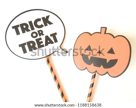 Speech ballon with the words trick or treat and pumkin stick over a white background giving sense of happy Halloween.