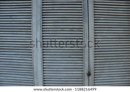 gray wooden background of thin boards in a lattice on the door