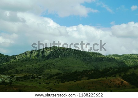 green hills and sky