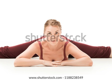 smiling adult woman doing doing twine and looking at camera isolated on white background 