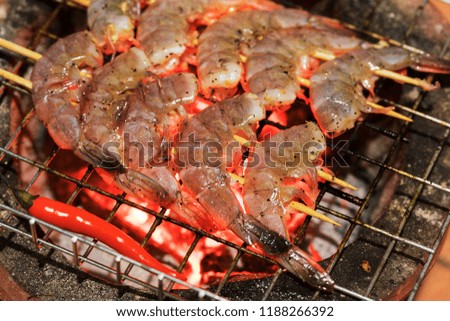 Fresh shrimps on barbecue outdoors