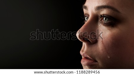 beauty girl cry on black background Royalty-Free Stock Photo #1188289456