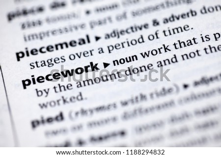 Close up to the dictionary definition of Piecework Royalty-Free Stock Photo #1188294832