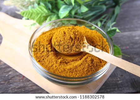 Curry powder in a glass bowl  Royalty-Free Stock Photo #1188302578