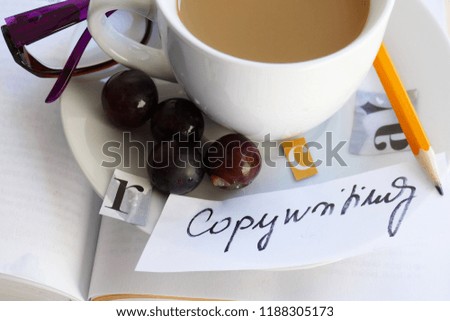 Copywriting - pen, words, cup of coffee fruit and letters
