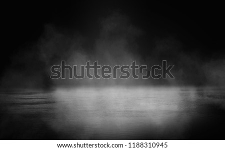 Background of an empty dark room. Empty walls, lights, smoke, glow, rays
