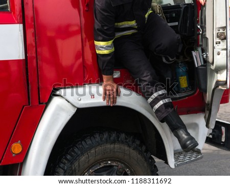 fireman extinguishes the fire with smoke. Firefighting exercises with fire extinguishing.