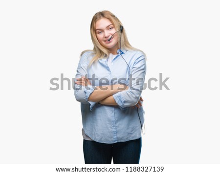 Young caucasian business woman wearing call center headset over isolated background happy face smiling with crossed arms looking at the camera. Positive person.