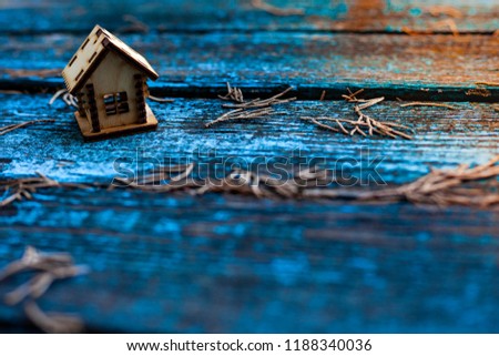 miniature house made of wood
blue wooden background.dry cypress sprigsImage for property real estate investment concept. Royalty-Free Stock Photo #1188340036
