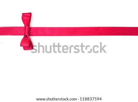 Red satin ribbon with bow isolated over white background. Royalty-Free Stock Photo #118837594