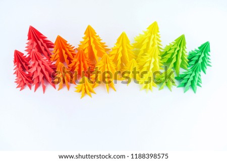 Multicolored paper Christmas tree on a white background. new Year Children's holiday. Rainbow origami