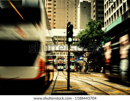 Pedestrians crossing the busy street on Hong Kong