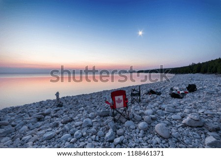 Early morning at a rocky beach after spending the night with friends photographing the sky in Ontario, Canada