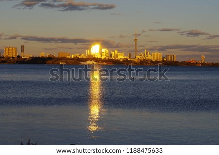 The downtown Toronto skyline at sunset with  water reflections