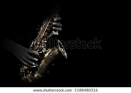 Saxophone player. Saxophonist playing jazz music instrument. Sax player hands Royalty-Free Stock Photo #1188480316