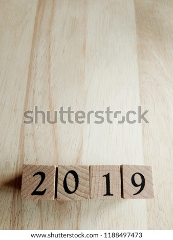 2019 Text New Year Card Template On Wooden Cubes On Wooden Background