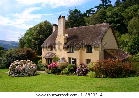 Thatched roof cottage in Selworthy village Somerset Royalty-Free Stock Photo #118859314