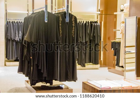 Black traditional muslim women dresses on display in a retail shop for the Middle East fashion to wear Burka or Niqab and Hijab and cover the body of a woman and girl from a certain age Royalty-Free Stock Photo #1188620410
