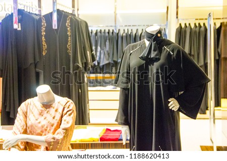 Black traditional muslim women dresses on display in a retail shop for the Middle East fashion to wear Burka or Niqab and Hijab and cover the body of a woman and girl from a certain age Royalty-Free Stock Photo #1188620413